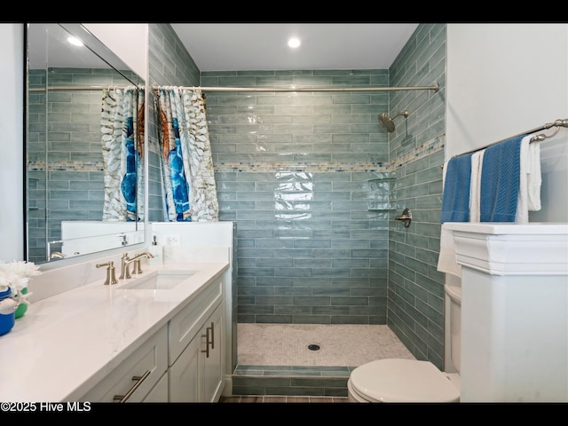 2083 New River Inlet Rd Unit A, North Topsail Beach, NC 28460 - full bath featuring vanity, toilet, a tile shower, and recessed lighting
