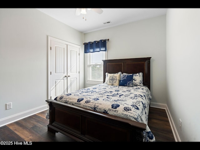 2083 New River Inlet Rd Unit A, North Topsail Beach, NC 28460 - bedroom featuring a closet, baseboards, dark wood finished floors, and ceiling fan