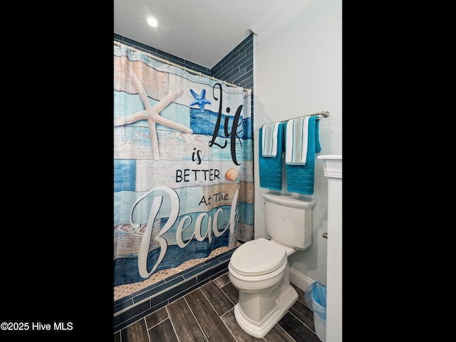 2083 New River Inlet Rd Unit A, North Topsail Beach, NC 28460 - bathroom featuring toilet, wood finished floors, and a shower with shower curtain