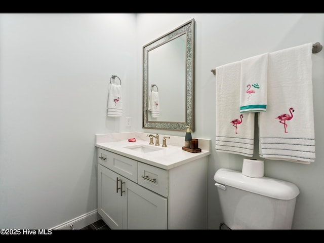 2083 New River Inlet Rd Unit A, North Topsail Beach, NC 28460 - bathroom with vanity, toilet, and baseboards
