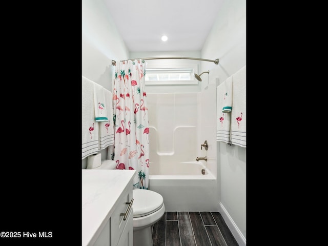 2083 New River Inlet Rd Unit A, North Topsail Beach, NC 28460 - full bath with toilet, shower / tub combo, wood finished floors, vanity, and baseboards