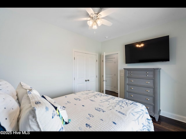 2083 New River Inlet Rd Unit A, North Topsail Beach, NC 28460 - bedroom with dark wood-type flooring, baseboards, a closet, and ceiling fan
