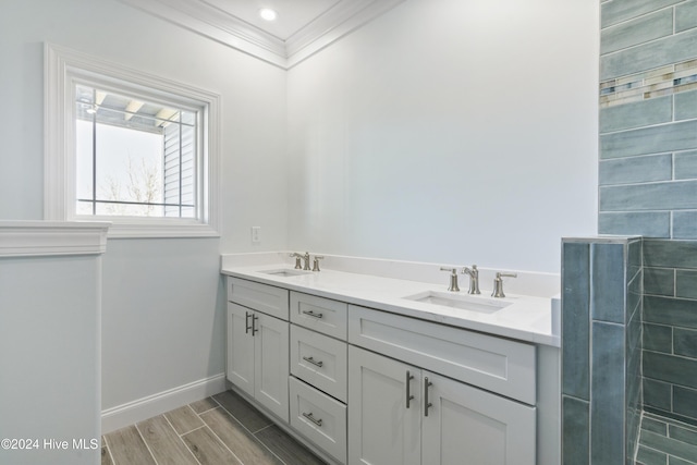 bathroom featuring vanity and crown molding