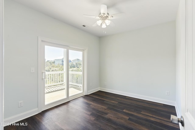 empty room featuring ceiling fan and dark wood-type flooring