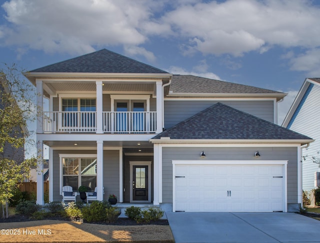 view of front of property with a balcony, a garage, and a porch