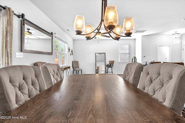 dining room featuring ceiling fan and visible vents