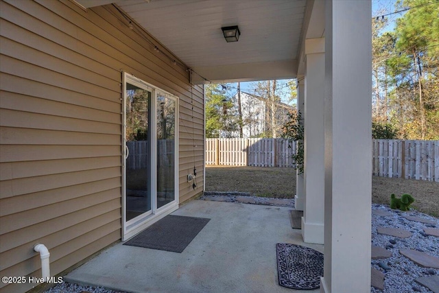 view of patio / terrace featuring fence