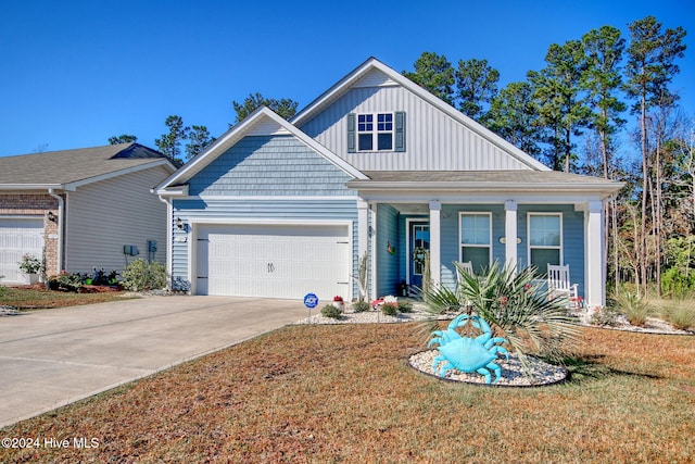 view of front of home with a porch and a garage