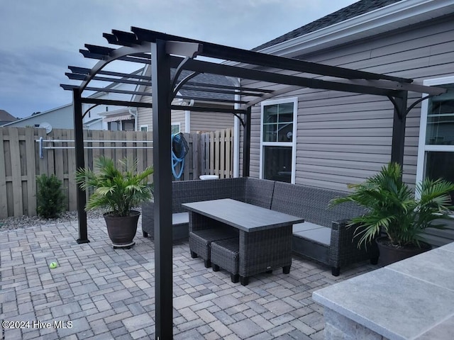 view of patio / terrace featuring an outdoor hangout area and a pergola