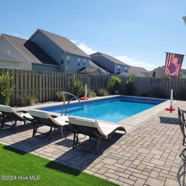 view of swimming pool featuring a patio