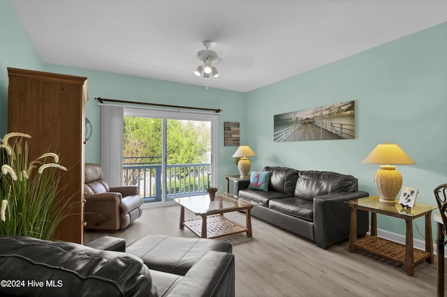 living room with ceiling fan and light wood-type flooring