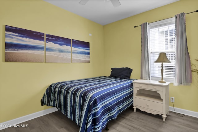 bedroom with ceiling fan and dark hardwood / wood-style flooring