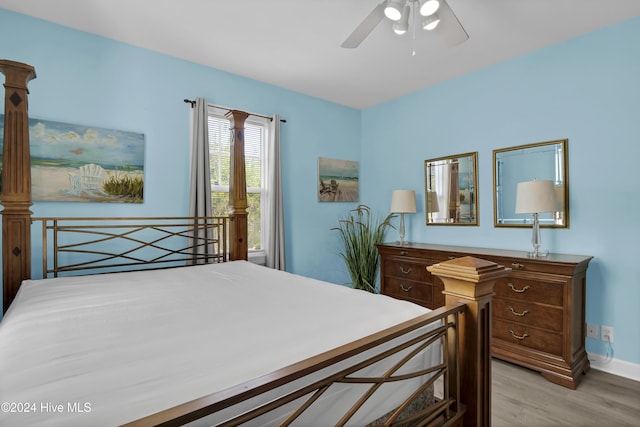 bedroom featuring ceiling fan and light hardwood / wood-style flooring