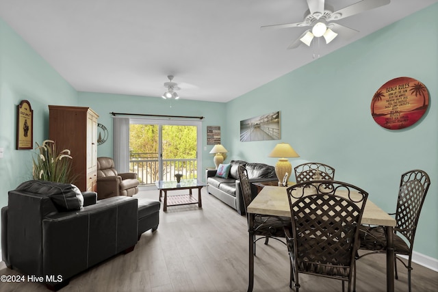 living room with hardwood / wood-style floors and ceiling fan