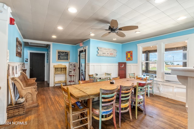 dining area featuring ceiling fan and dark wood-type flooring