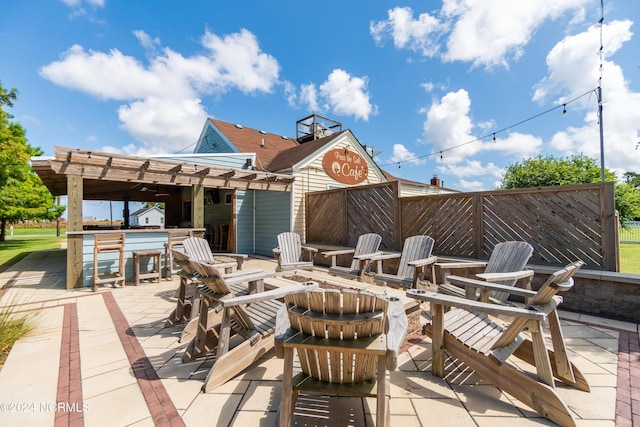 view of patio with a pergola and exterior bar