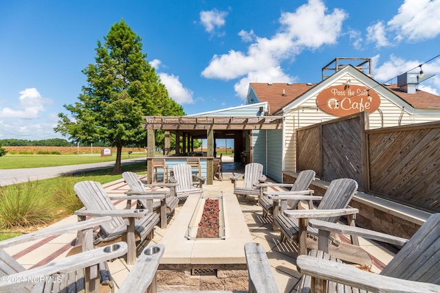 view of patio / terrace featuring a fire pit