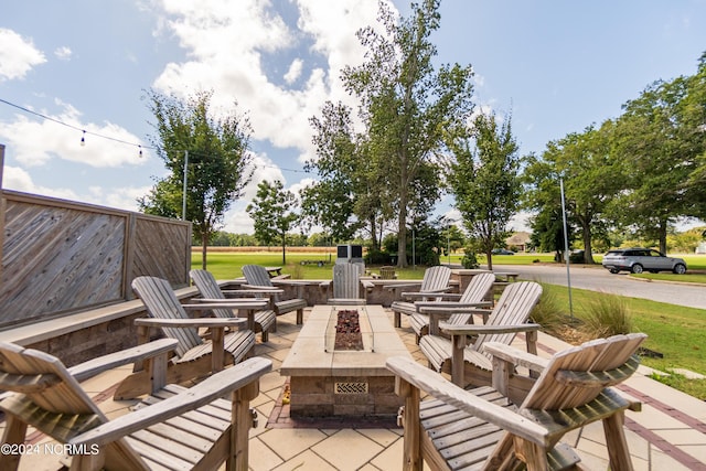 view of patio / terrace featuring an outdoor fire pit