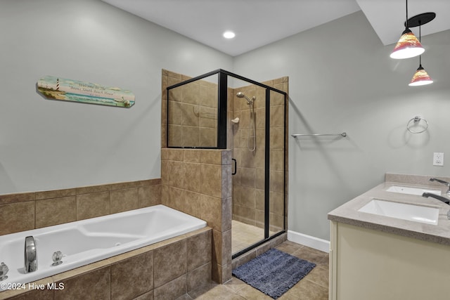 bathroom with tile patterned flooring, vanity, and independent shower and bath