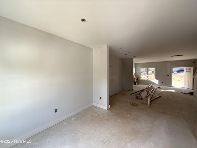 empty room featuring baseboards