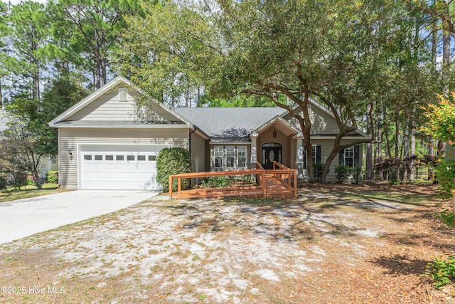 3882 White Blossom Cir, Southport, NC 28461 - ranch-style home with roof with shingles, a garage, and concrete driveway