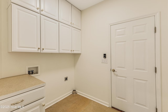 3882 White Blossom Cir, Southport, NC 28461 - washroom featuring electric dryer hookup, baseboards, washer hookup, and cabinet space