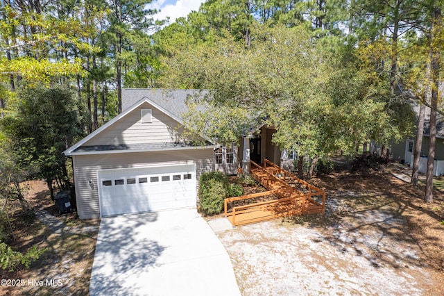 3882 White Blossom Cir, Southport, NC 28461 - view of front of property featuring an attached garage and driveway