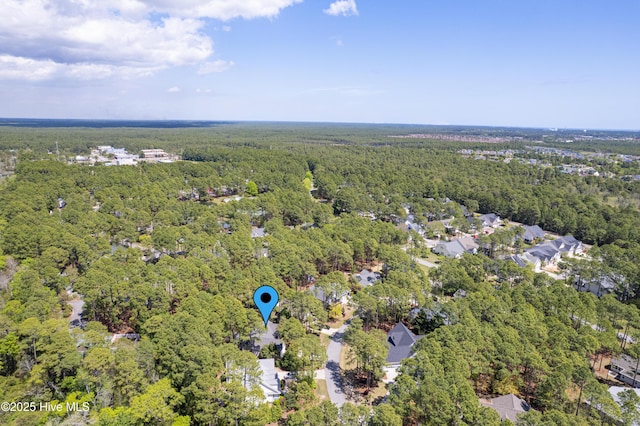 3882 White Blossom Cir, Southport, NC 28461 - drone / aerial view featuring a wooded view