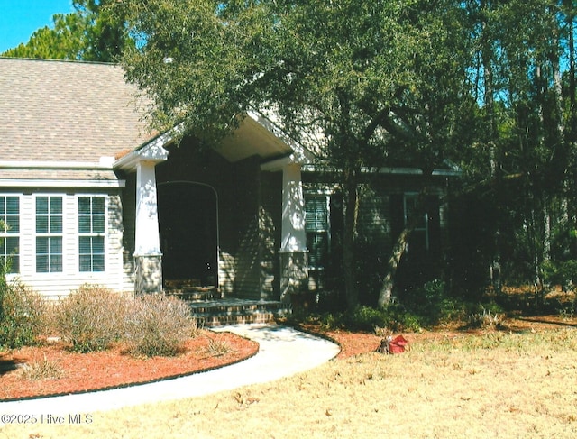 3882 White Blossom Cir, Southport, NC 28461 - view of front facade with roof with shingles