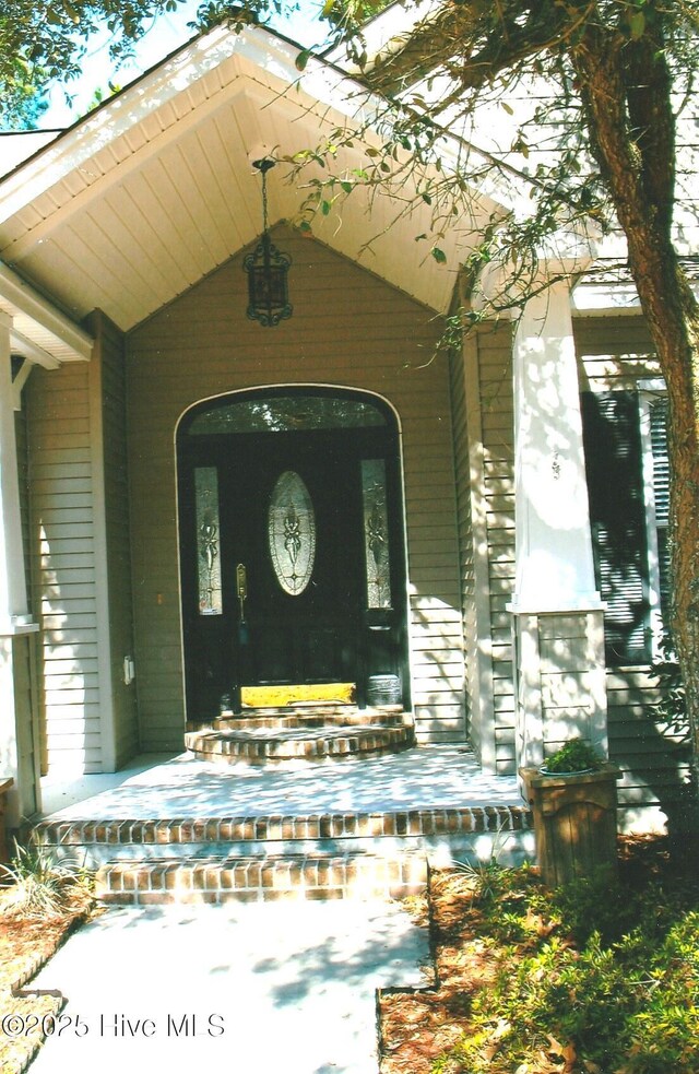 3882 White Blossom Cir, Southport, NC 28461 - property entrance with covered porch
