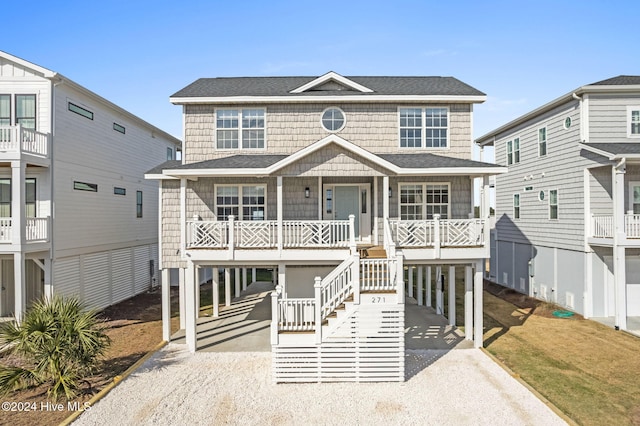 beach home with covered porch and a carport