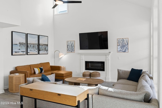 living room featuring hardwood / wood-style flooring and ceiling fan