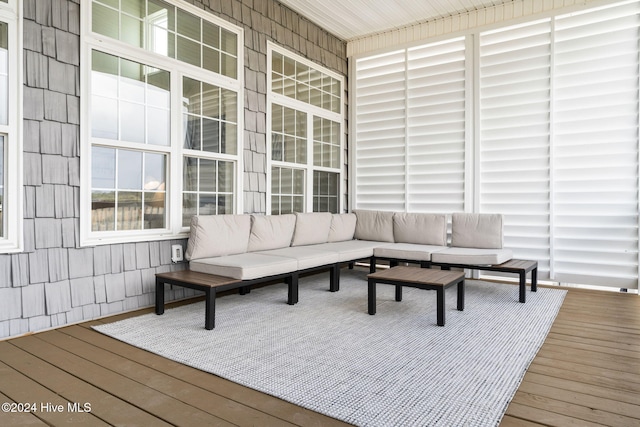 wooden terrace featuring outdoor lounge area