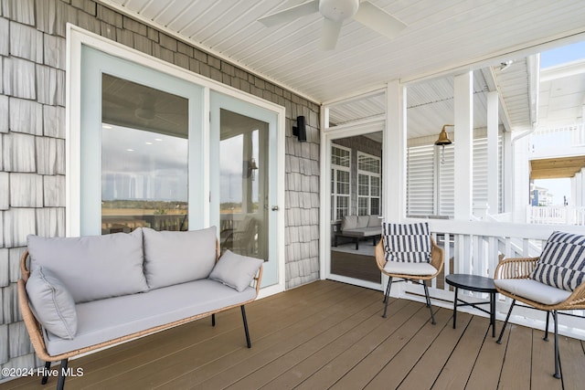 sunroom / solarium featuring ceiling fan and plenty of natural light