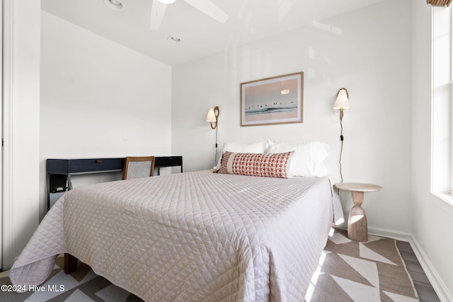 bedroom featuring hardwood / wood-style floors and ceiling fan