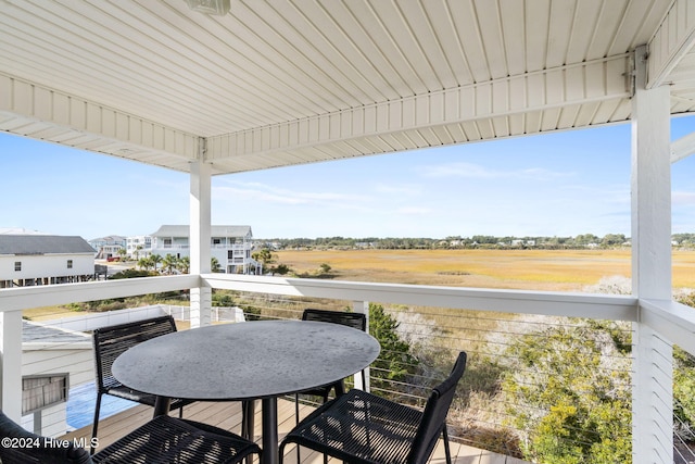 view of patio featuring a balcony