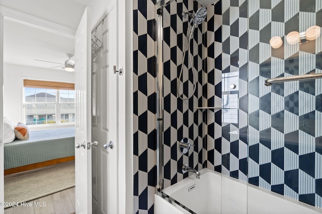 bathroom with tiled shower / bath combo and ceiling fan