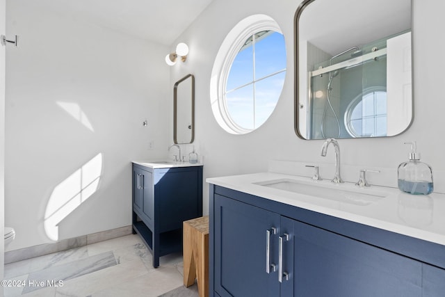 bathroom with vanity, an enclosed shower, and toilet