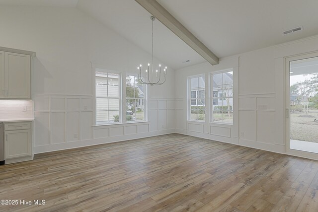 unfurnished room featuring light hardwood / wood-style flooring, a raised ceiling, ceiling fan, and ornamental molding