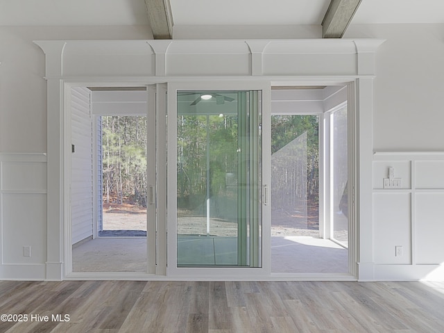 entryway with beamed ceiling and hardwood / wood-style flooring