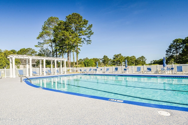 view of swimming pool featuring a pergola