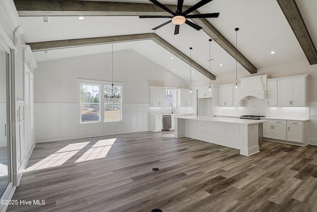 kitchen with white cabinetry, a center island, dark wood-type flooring, pendant lighting, and custom exhaust hood