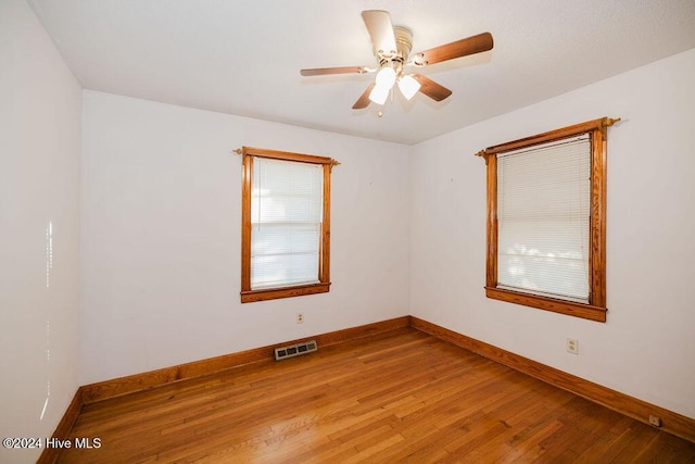 empty room featuring ceiling fan and light wood-type flooring