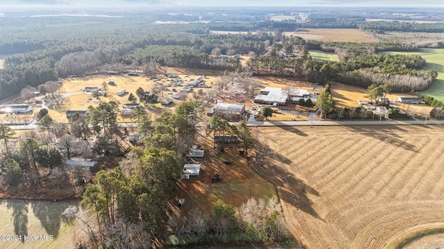 birds eye view of property featuring a rural view