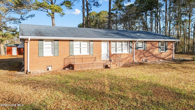 ranch-style house with a front lawn