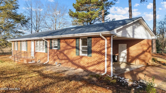 exterior space with a carport