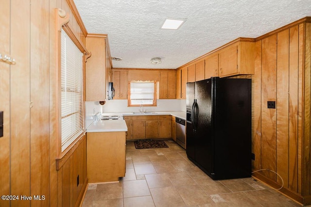 kitchen with dishwasher, a textured ceiling, black refrigerator with ice dispenser, and sink