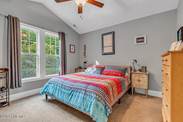 carpeted bedroom featuring ceiling fan and lofted ceiling