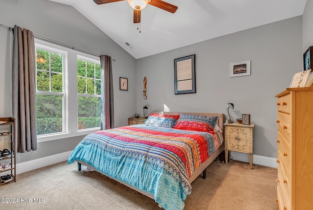 bedroom with lofted ceiling, visible vents, a ceiling fan, light carpet, and baseboards