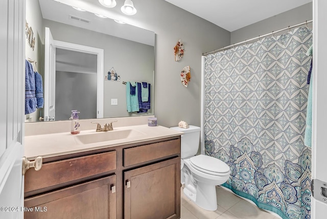 full bath with toilet, vanity, visible vents, and tile patterned floors